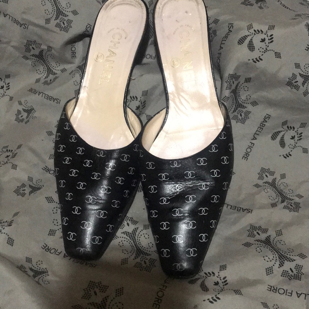 Chanel Vintage Slip Ons with Chanel logo.